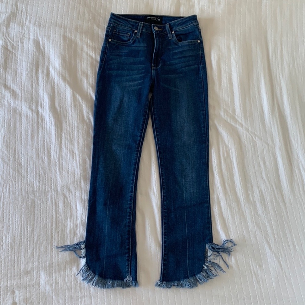 Blue jeans with frayed bottoms